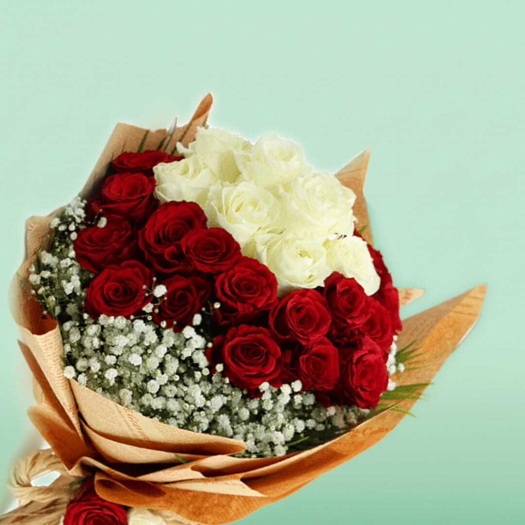 Red and white roses with delicate gypsophila wrapped in brown and cream non-woven paper