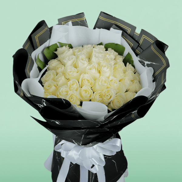 50 White roses bouquet in elegant Korean-style wrap.
