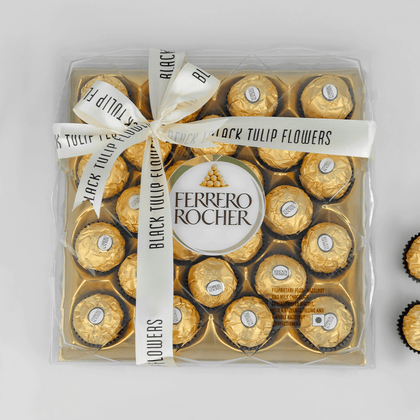 Gift box featuring 24 Ferrero Rocher chocolates, finished with a Black Tulip Flowers ribbon.