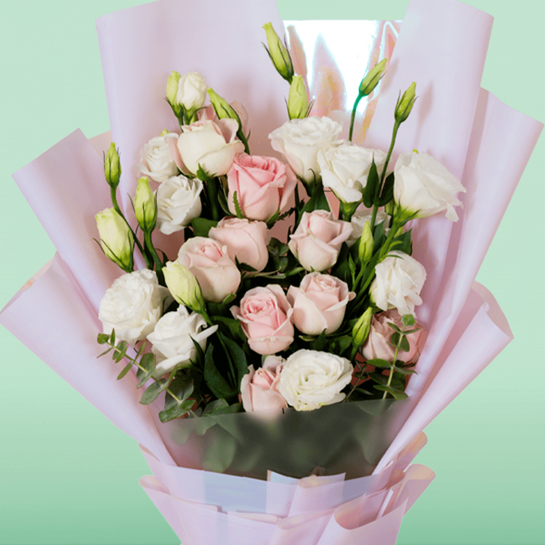 Pink Roses and white Eustoma in soft pink Korean-style wrapping with a decorative “Mom” topper.