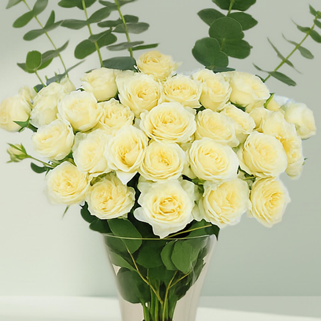 White Roses with Eucalyptus Vase arranged with 20 white roses and eucalyptus