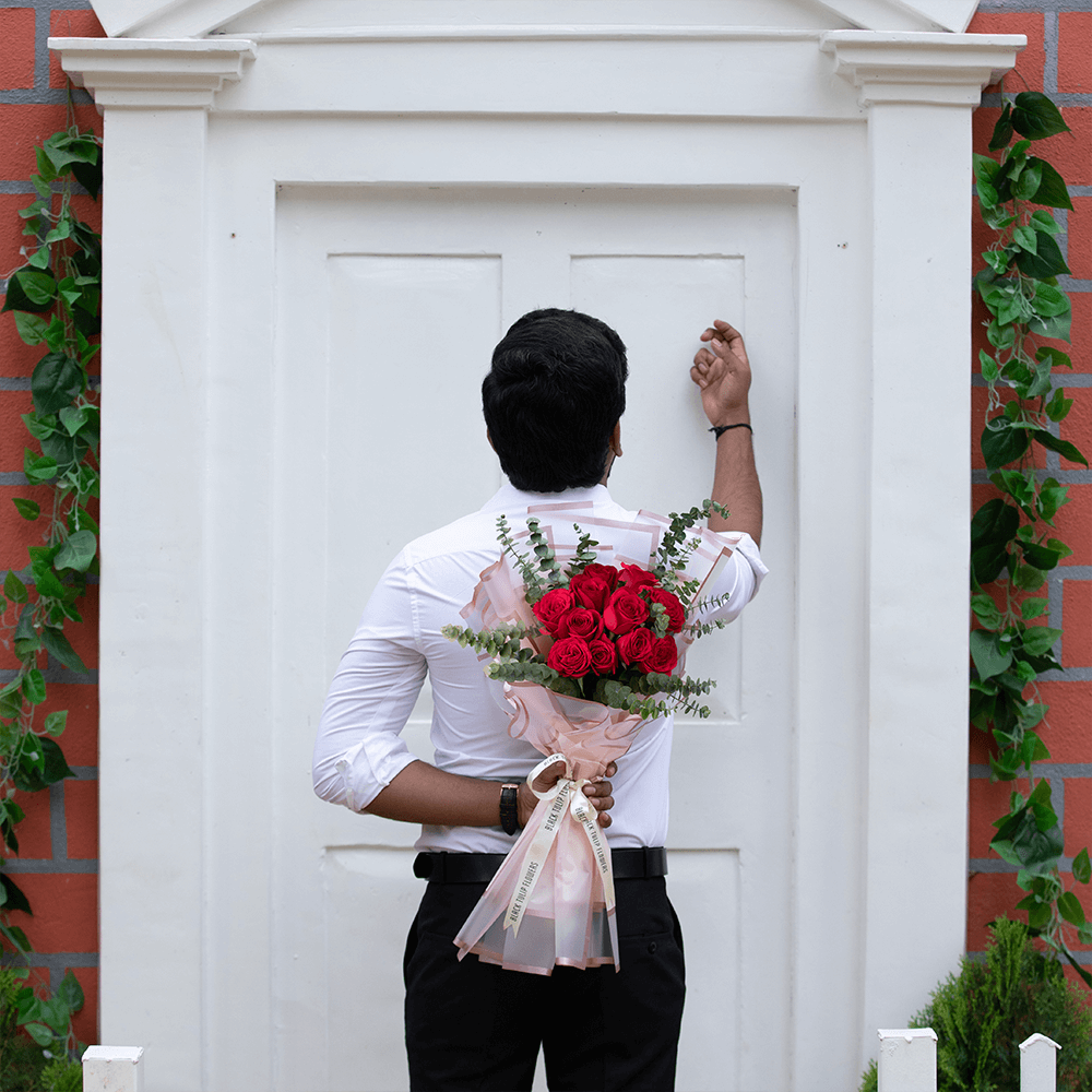 A bouquet of 15 red roses with Eucalyptus wrapped in Korean-style flower sheets.