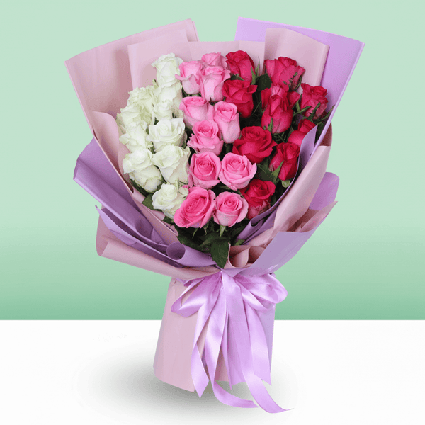 30–35 mixed white pink and red roses bouquet in soft wrapping