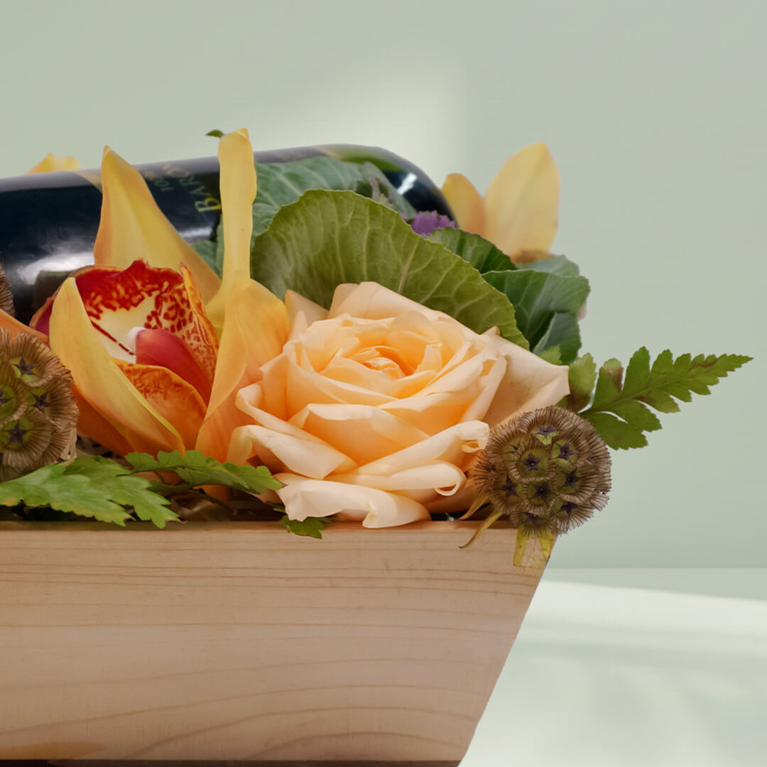 Vino Petals bouquet with 16 assorted Cymbidium, Scabiosa, roses, cabbage flowers and leather leaf, paired with premium non-alcoholic wine 750ml.