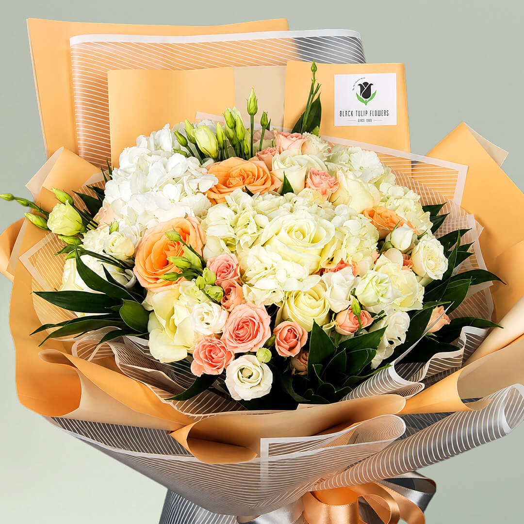 Exotic mixed flower bouquet with roses, Eustoma and spray roses in Korean wrapping