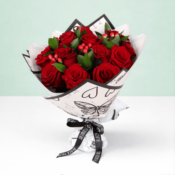 Red Romance Rose Bouquet arranged with red roses, berries and fresh fillers