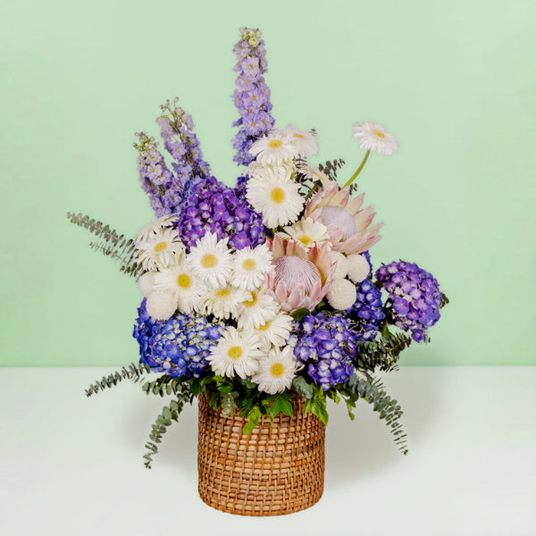 Luxury assorted flower basket with protea, hydrangea, gerberas and eucalyptus