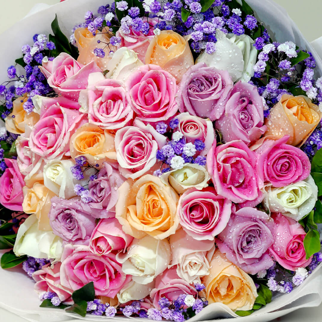 Assorted pastel roses and gypsophila bouquet with pink, peach, lavender, white and cream flowers