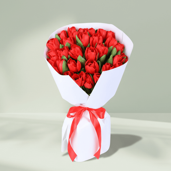 Red Tulip Passion Bouquet arranged with 30 red tulips with premium white wrapping.