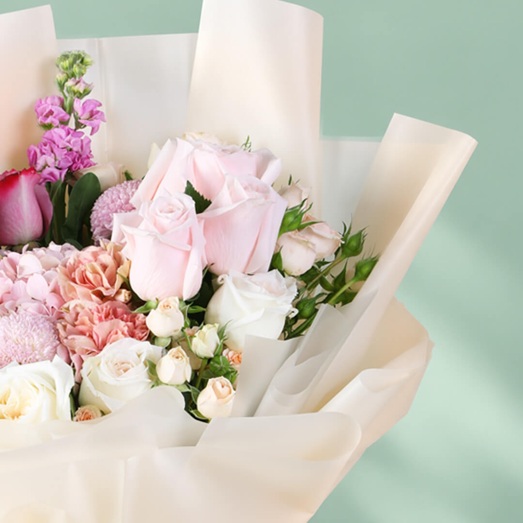Mixed bouquet featuring hydrangea, stock, roses, spray roses and ping pong