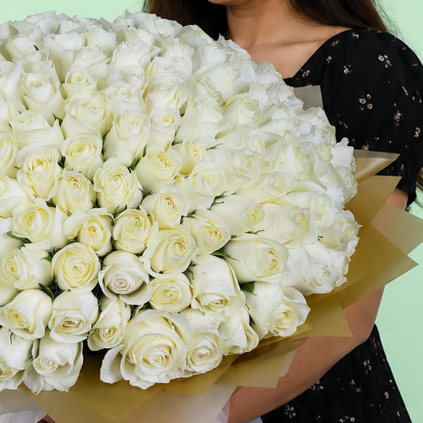 100 white roses hand bouquet with elegant wrapping for premium gifting
