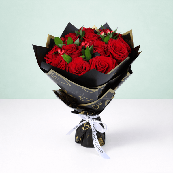 Red Elegance Valentine Bouquet arranged with 20 red roses with hypericum berries