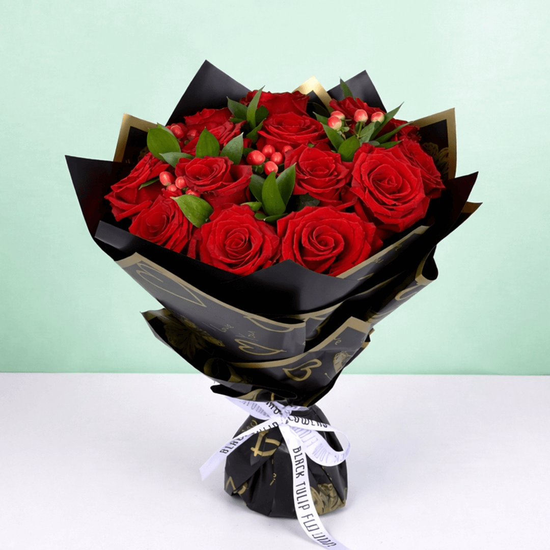 Red Elegance Valentine Bouquet arranged with 20 red roses with hypericum berries