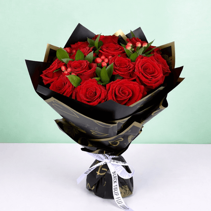 Red Elegance Valentine Bouquet arranged with 20 red roses with hypericum berries
