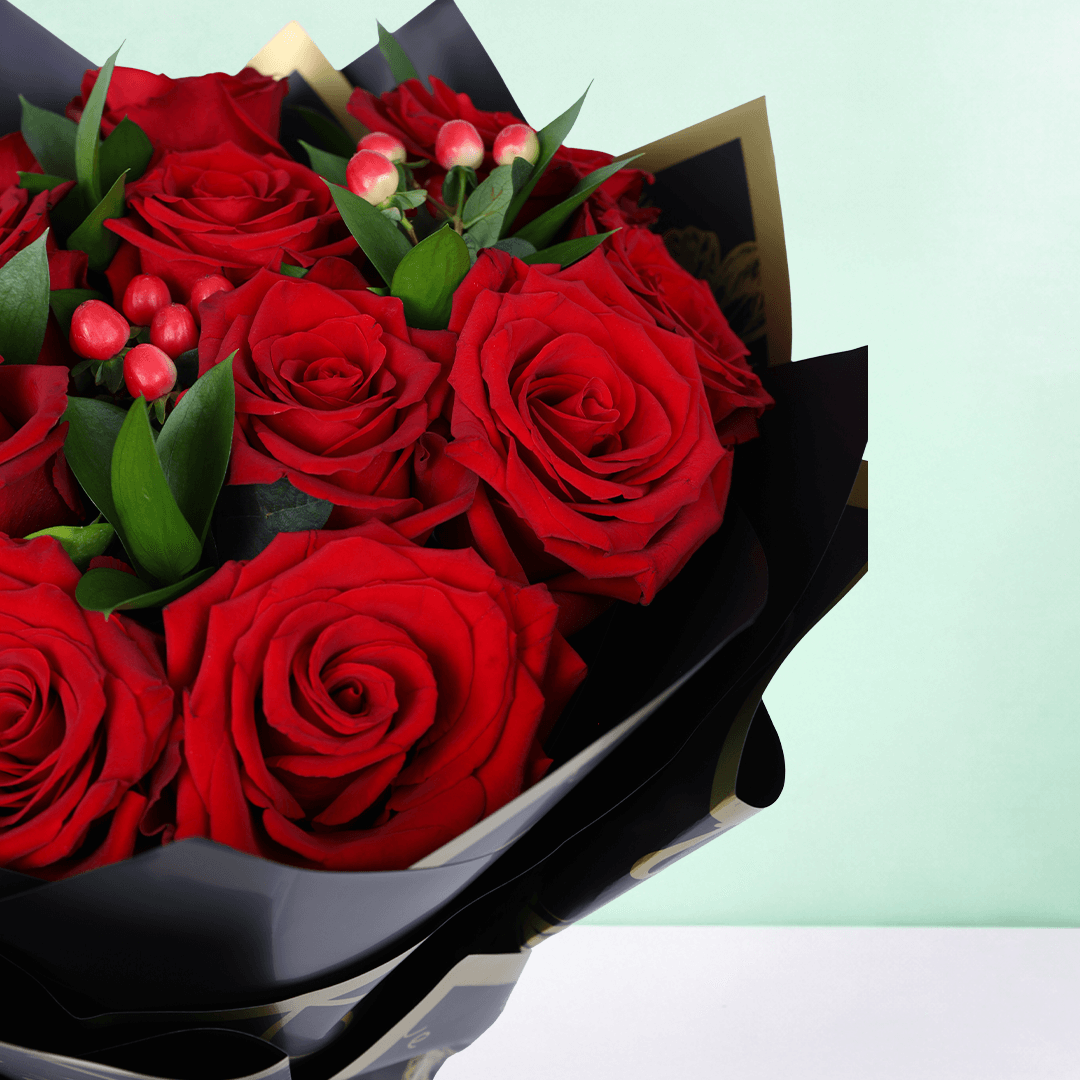 Red Elegance Valentine Bouquet arranged with 20 red roses with hypericum berries