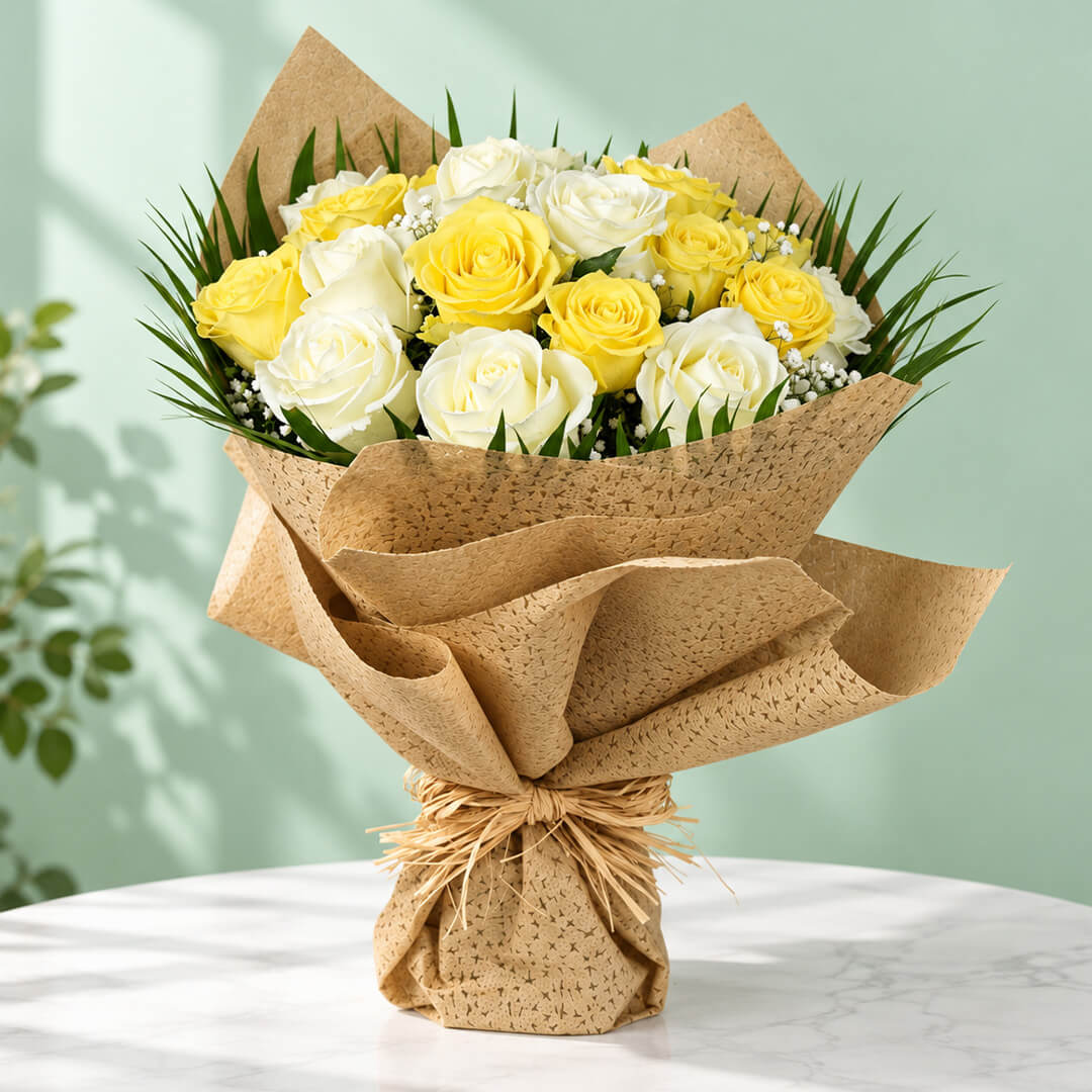 20 yellow and white roses with fresh green leaves arranged as a flower bouquet for gifting