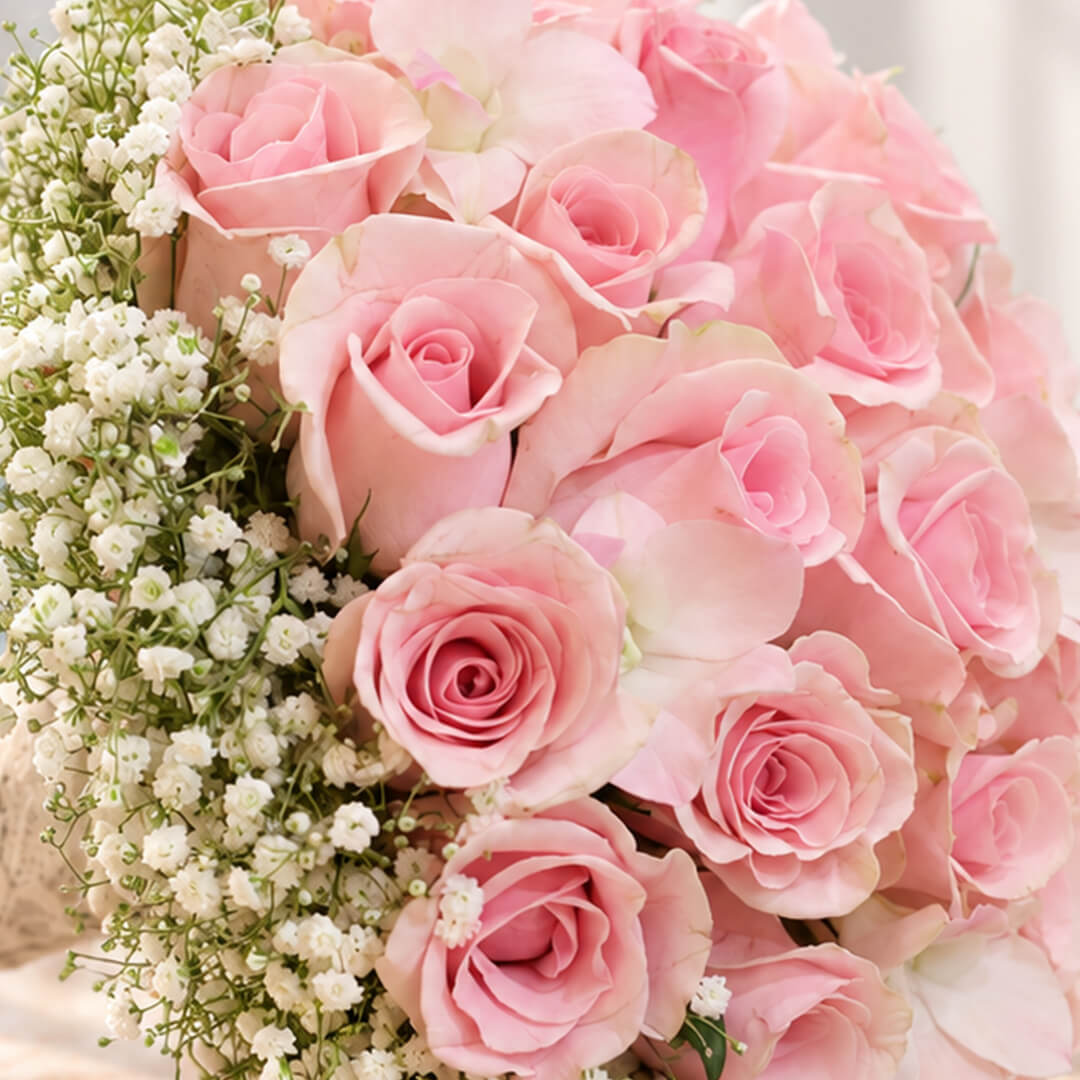 Luxury pink rose and gypsophila wedding bouquet with minimalist styling