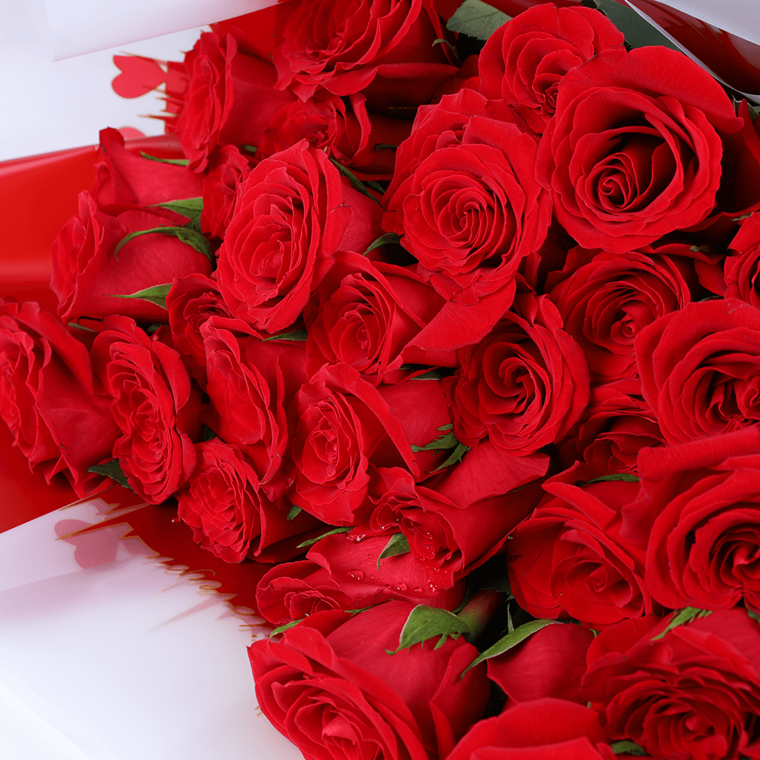 Red Enchantment 30 Rose Bouquet arranged with 30 red roses with fresh greenery