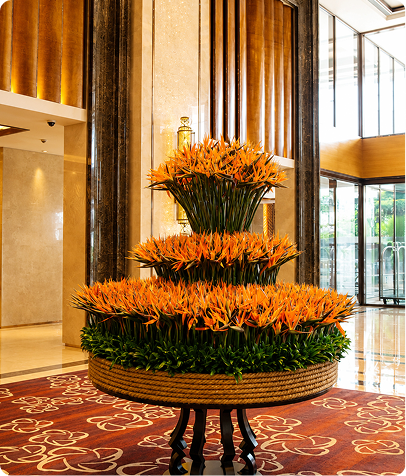 Tiered orange floral display