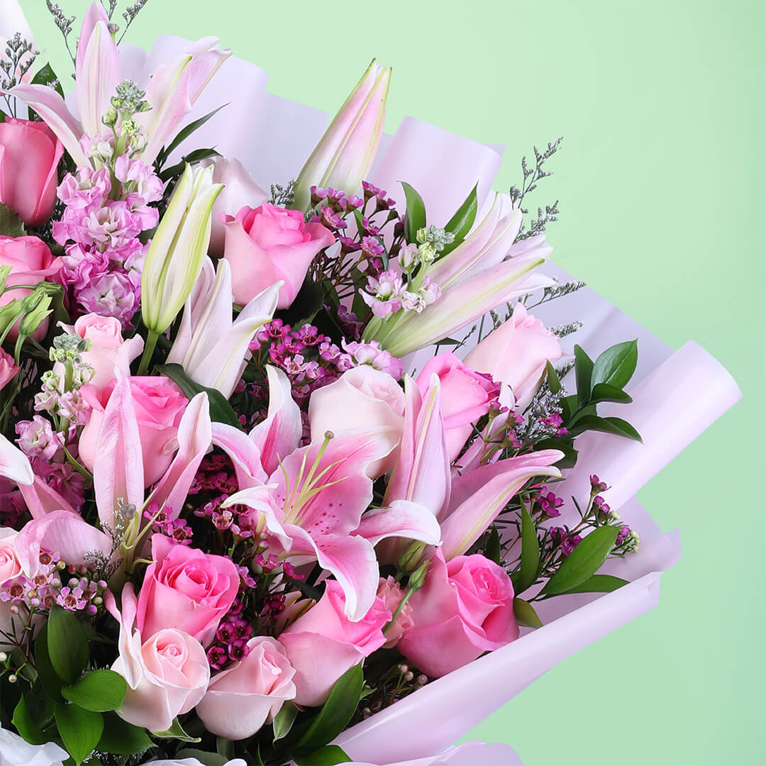 Pink mixed blooms bouquet wrapped in Korean-style flower sheets