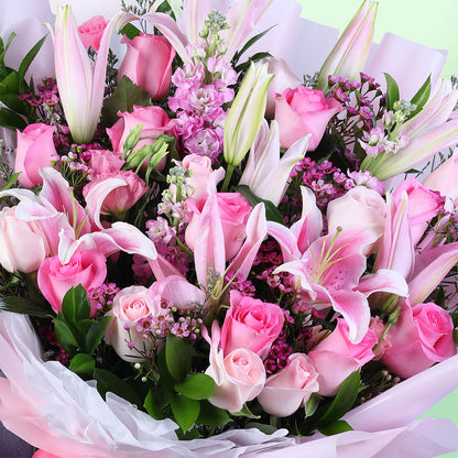 Pink mixed blooms bouquet wrapped in Korean-style flower sheets