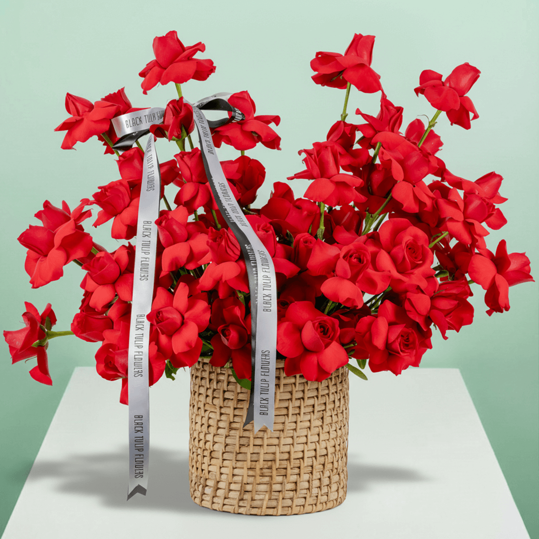 Red Velvet 50 Rose Basket arranged with 50 fresh red roses with lush greenery