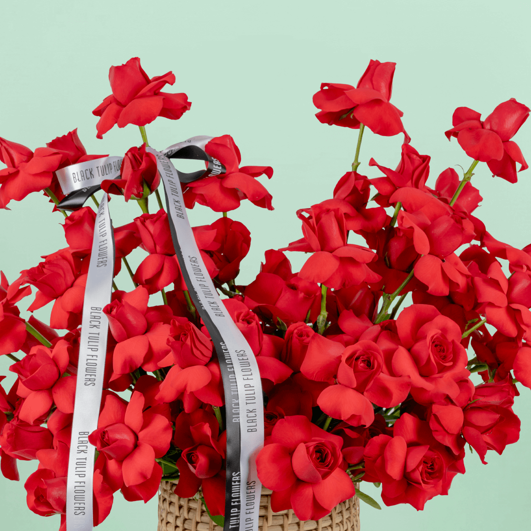 Red Velvet 50 Rose Basket arranged with 50 fresh red roses with lush greenery