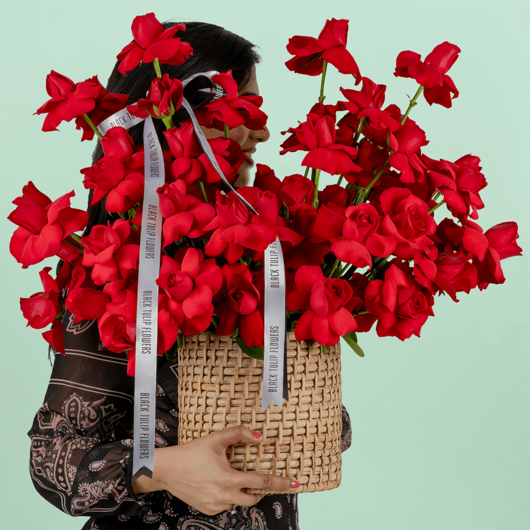 Red Velvet 50 Rose Basket arranged with 50 fresh red roses with lush greenery