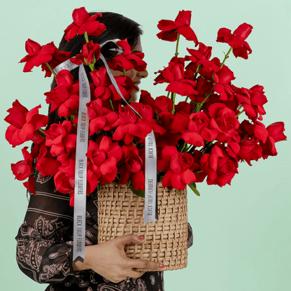 Red Velvet 50 Rose Basket arranged with 50 fresh red roses with lush greenery