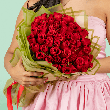 50 Red Rose Love You Bouquet arranged with 50 red roses with fresh fillers and a Love You topper