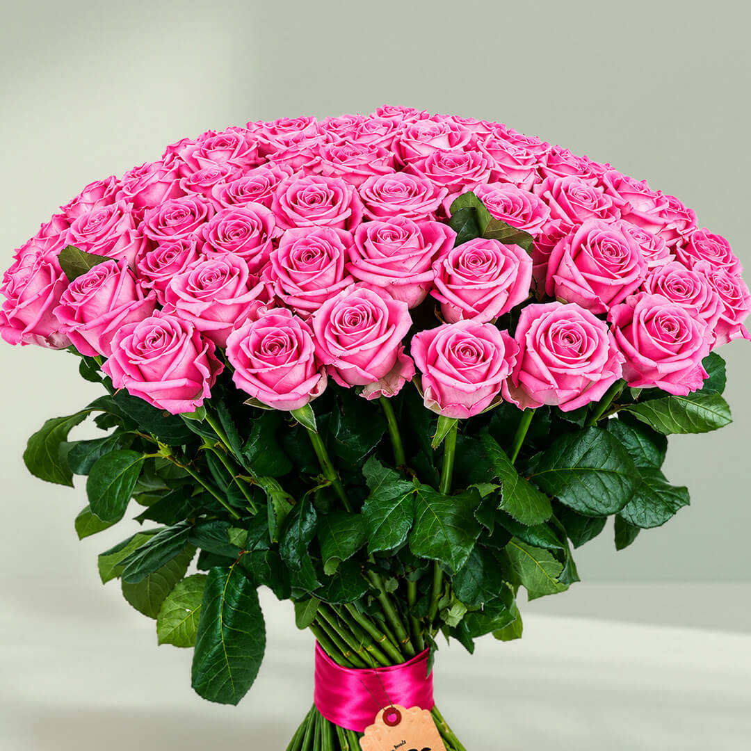 Beautiful luxury pink rose bouquet featuring 75 fresh roses in a lush rounded arrangement