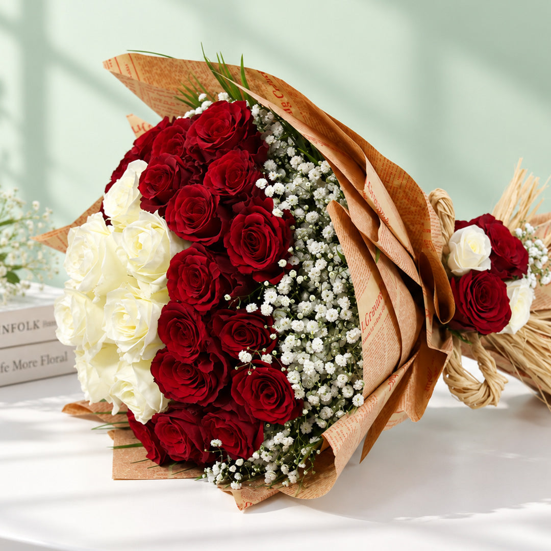 Red and white roses with delicate gypsophila wrapped in brown and cream non-woven paper