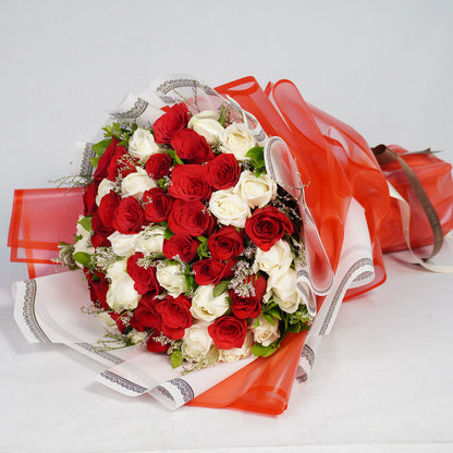 Bouquet of 40 red and white Roses with Limonium wrapped in red and white Korean-style flower sheets.