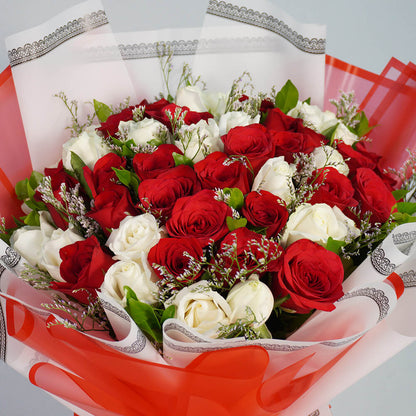 Bouquet of 40 red and white Roses with Limonium wrapped in red and white Korean-style flower sheets.