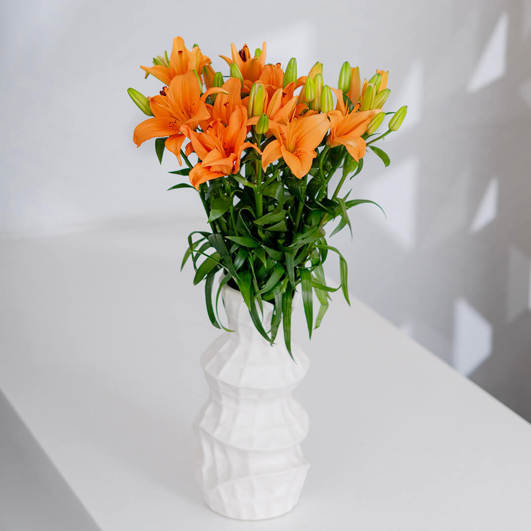 Asiatic lily flowers with broad petals and large open blooms arranged as fresh cut stems