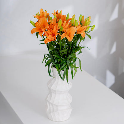 Asiatic lily flowers with broad petals and large open blooms arranged as fresh cut stems
