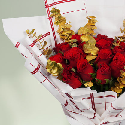Aurum Roses bouquet with 26 red and gold roses and eucalyptus