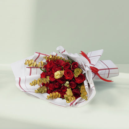 Aurum Roses bouquet with 26 red and gold roses and eucalyptus