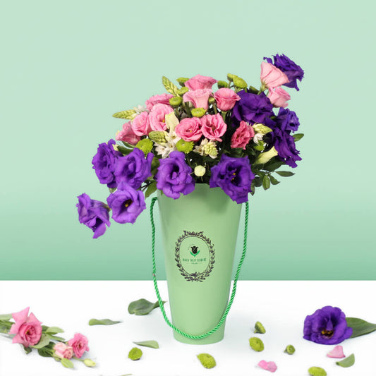 Blooming Elegance arrangement with 30 assorted Eustoma, Ornithogalum and button green chrysanthemums in a curved glass vase