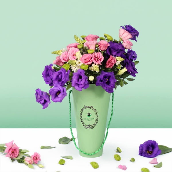 Blooming Elegance arrangement with 30 assorted Eustoma, Ornithogalum and button green chrysanthemums in a curved glass vase