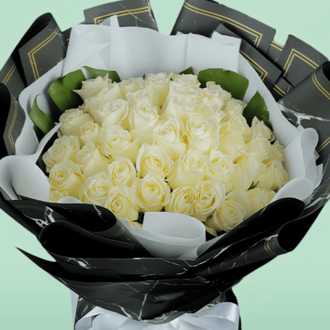 50 White roses bouquet in elegant Korean-style wrap.
