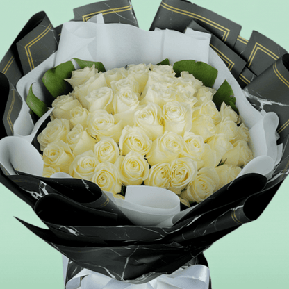 50 White roses bouquet in elegant Korean-style wrap.