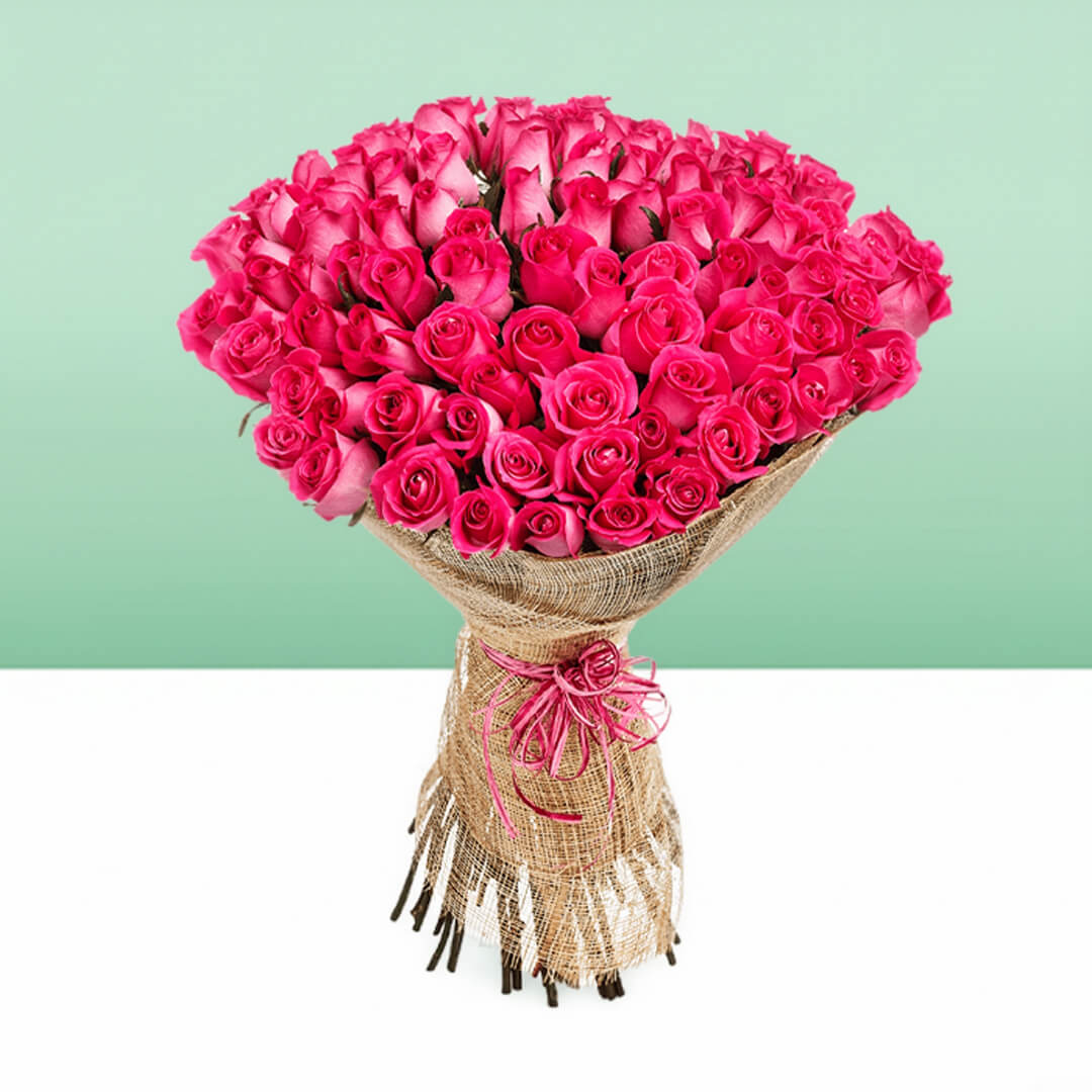 Bouquet of 50 pink roses wrapped in natural jute and tied with a pink ribbon