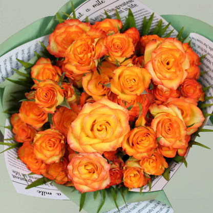 Charming orange rose bouquet with fresh blooms arranged beautifully for gifting.