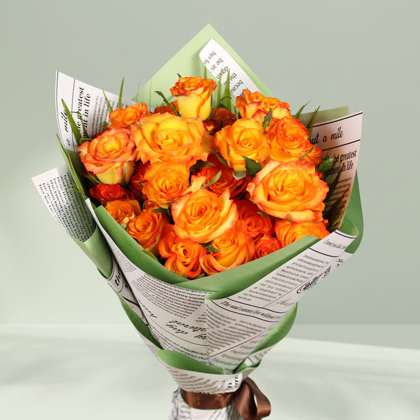 Charming orange rose bouquet with fresh blooms arranged beautifully for gifting.