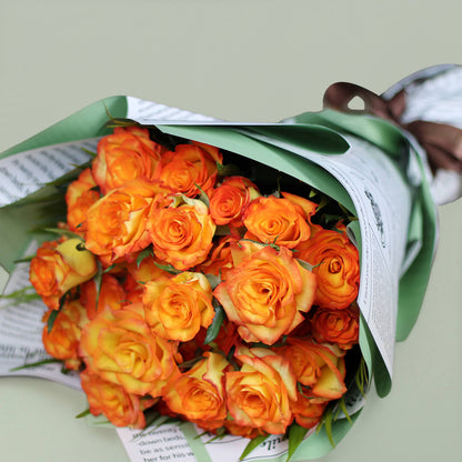 Charming orange rose bouquet with fresh blooms arranged beautifully for gifting.