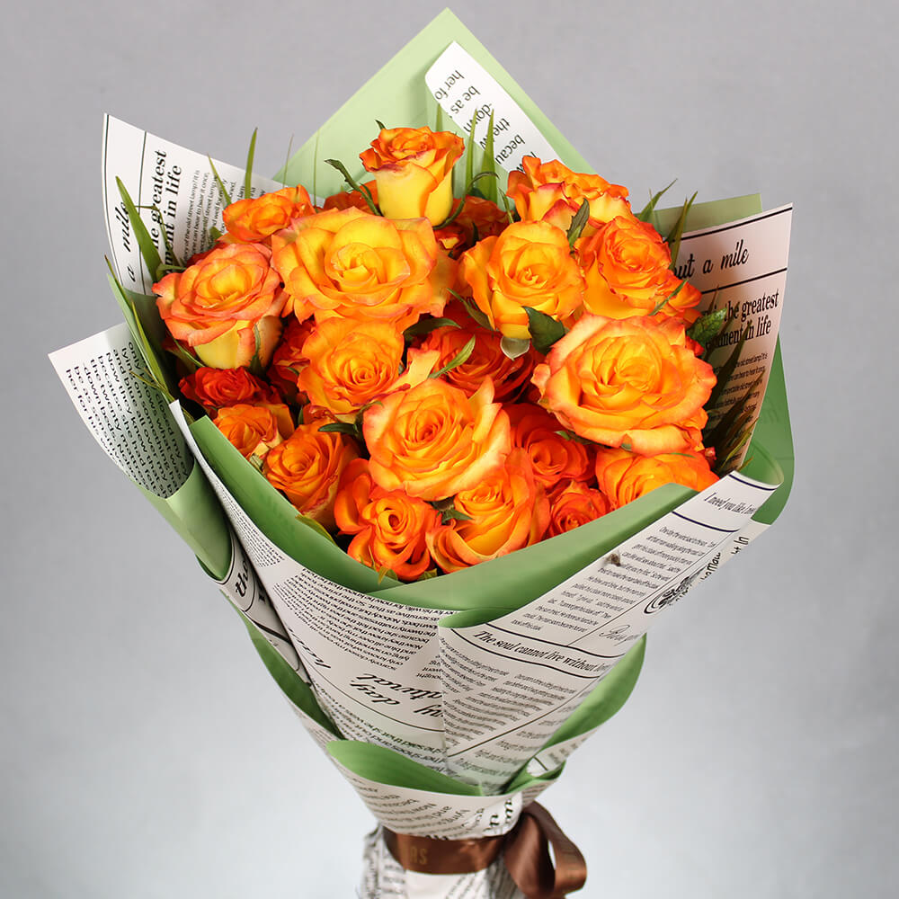 Bouquet of 40 fresh orange roses arranged in green and newspaper-style Korean wrapping sheets.