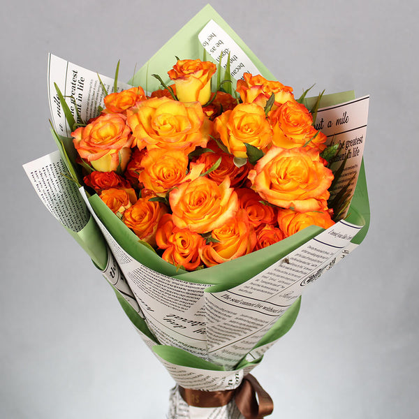 Bouquet of 40 fresh orange roses arranged in green and newspaper-style Korean wrapping sheets.