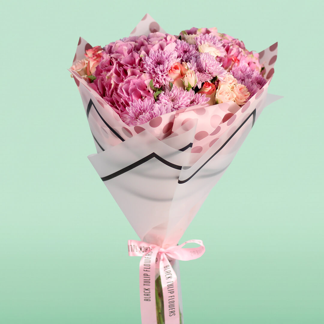 Pink Hydrangeas, Roses, Spray Roses and Chrysanthemums wrapped in Korean-style flower sheets.
