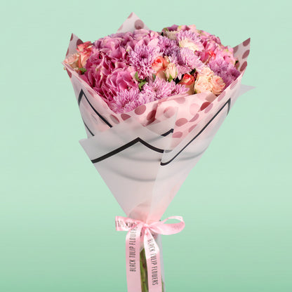 Pink Hydrangeas, Roses, Spray Roses and Chrysanthemums wrapped in Korean-style flower sheets.